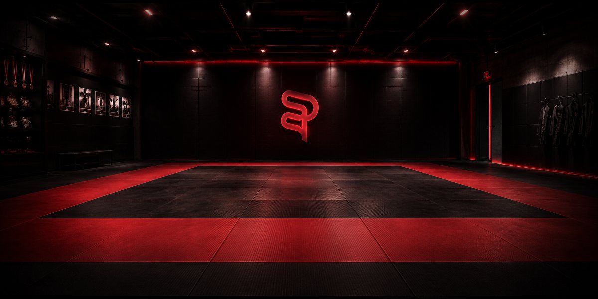 Empty martial arts mat in a dark gym — low student retention